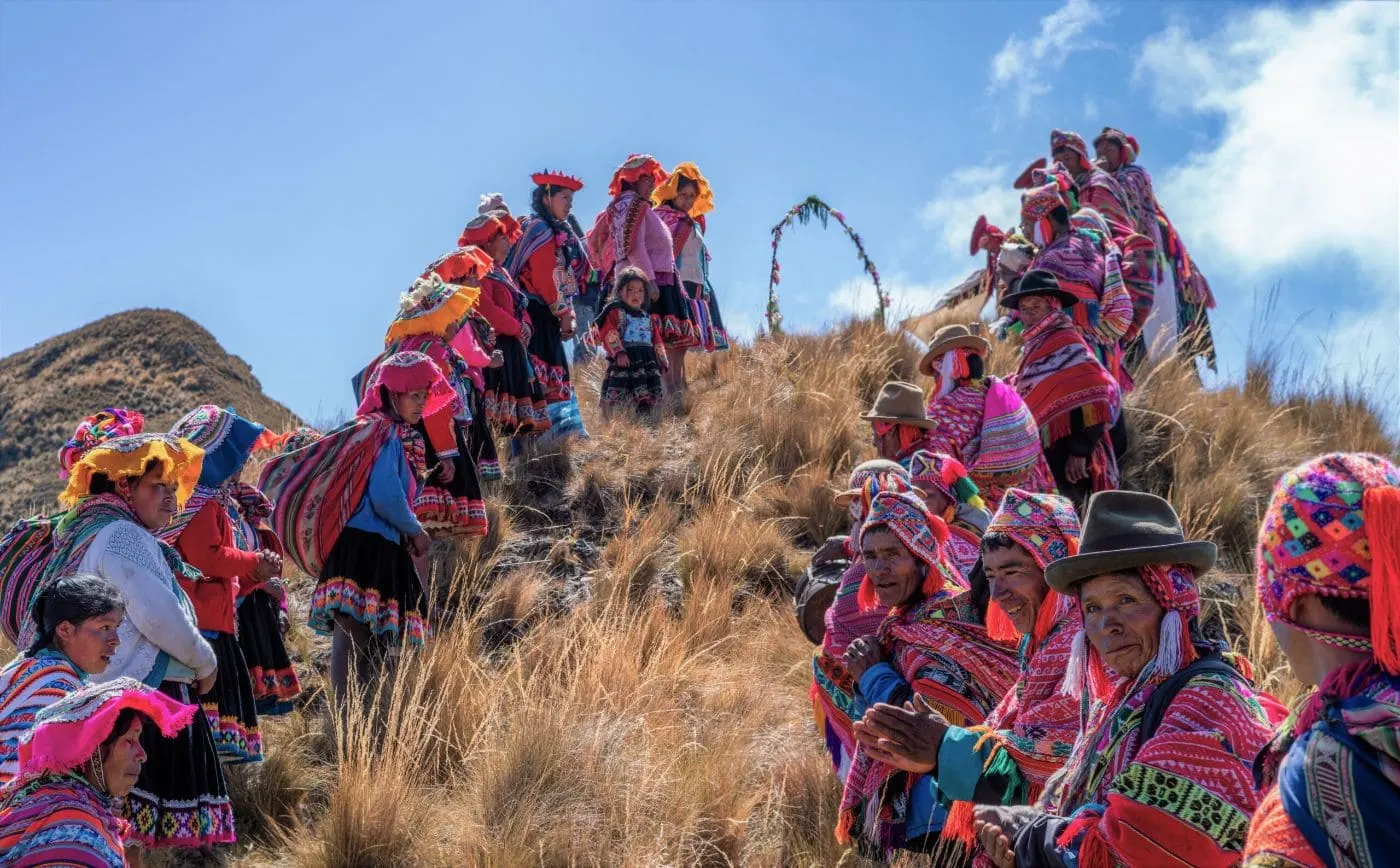 Participants gather on a mountain slope during the Andean New Year celebration